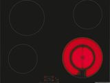 une image représentant une plaque de cuisson noire et rouge à trois feux