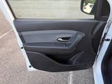 the door of a car with the driver ' s side window open