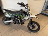 a dirt bike that is sitting on the floor