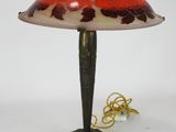 an image of a lamp with a red and white shade on top of it