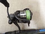 a fishing rod with a reel attached to it
