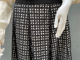 an image of a mannequin wearing a black and white dress
