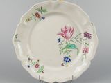 une image représentant une assiette sur laquelle sont peintes des fleurs