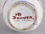 a close up of a vase with the word b zimber written on it