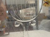 a vase with flowers in it sitting on a window sill