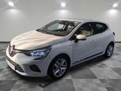 the white car is parked on a checkered floor in the garage