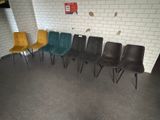 five chairs lined up in a row in a room
