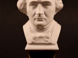 a close up of a bust of a man with a bow tie