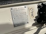a close up of a motorcycle with a number plate on it