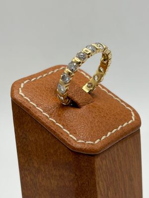 a ring that is sitting on top of a wooden box
