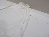 a white shirt with a lace collar on it