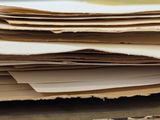 a stack of papers sitting on top of a table