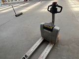 an image of a forklift in a warehouse with a fork on the ground
