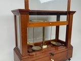 a wooden display case with a mirror on top of it