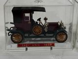a small model of an old car in a clear box