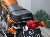a motorcycle that is parked on the side of the street