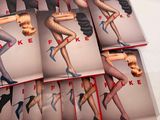 six books of women ' s stockings and stockings are stacked on top of each other
