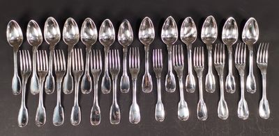 a lot of spoons and forks on the table