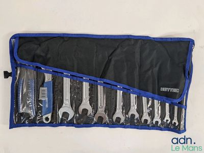 many wrenches in a blue case on the table