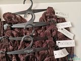 several different types of clothes hang on a hanger