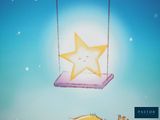 a little girl that is sitting on a swing with a star on it