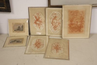 five framed pictures on a table with a mirror in the background