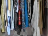 a closet with a lot of clothes and shoes
