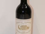 a bottle of wine that is sitting on a table