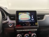 the dashboard of a car with a gps device in the center of it