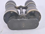 a close up of a pair of binoculars on a white surface