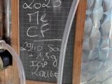 a blackboard with a chalkboard on it next to a water faucet