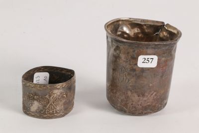 an image of a silver cup and a silver cup on a white surface