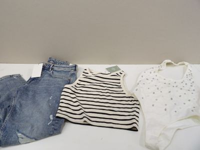 three pairs of shorts and a shirt on a table