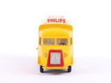 a small yellow bus with a sign on top of it