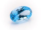 an oval blue topazte gems on a white background