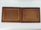 pair of antique wooden picture frames with brown paint on them