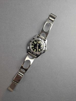 an image of a watch sitting on top of a table