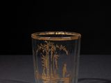 an image of a glass cup with a picture of a man and a woman on it