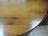 a wooden table with a clock on top of it