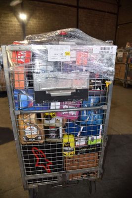 a metal cart with many items in it in a warehouse