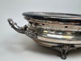 a silver bowl that is sitting on a table
