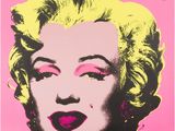 an image of a pink and yellow poster with a woman ' s face