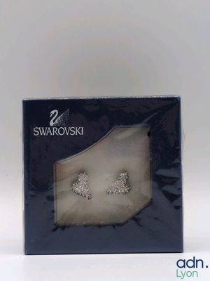 a box with a pair of earrings inside of it