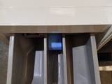 a drawer that has three bins inside of it