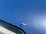 a close up of a car ' s headlight with a lot of dirt on it