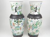 pair of chinese vases with birds and flowers painted on them