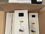 two boxes of electronic equipment sitting on the floor