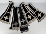 three black and white stoles with crosses and crosses on them