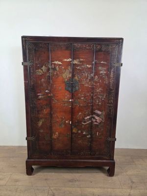 an image of a wooden cabinet sitting on top of a hard wood floor