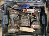 many tools in a toolbox that are sitting on the floor